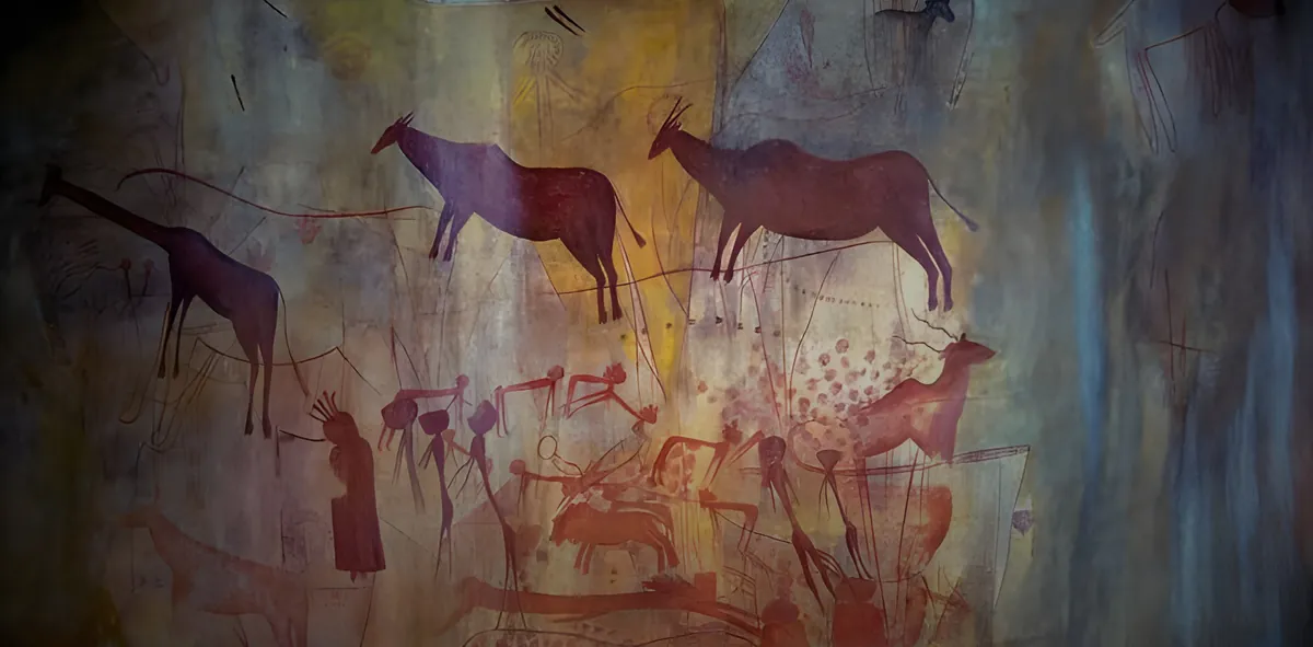 Red ochre rock paintings of giraffe and antelope at Kondoa