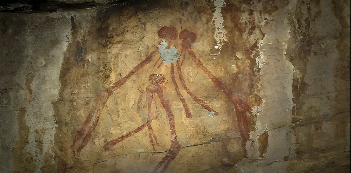 Ancient red ochre figures painted on a rock shelter wall at Kondoa
